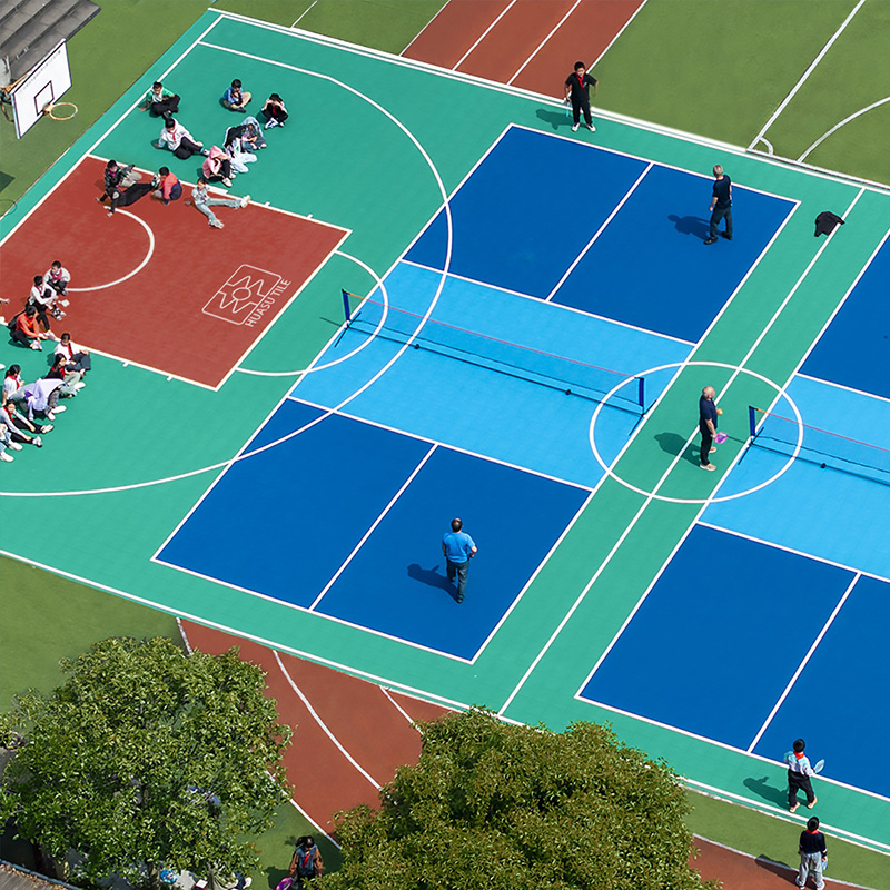 Pickleball-basketball combo court surfaces